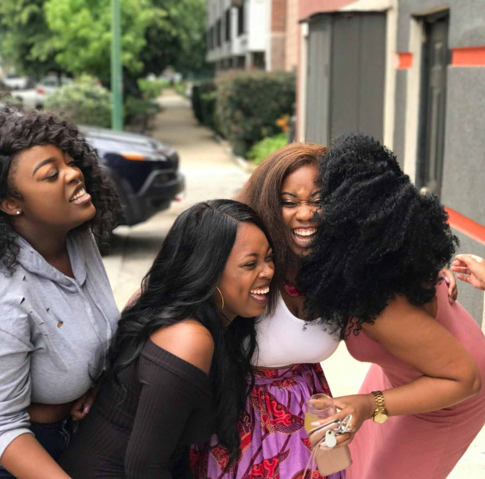 Group of women laughing and enjoying each other's company in a joyful moment