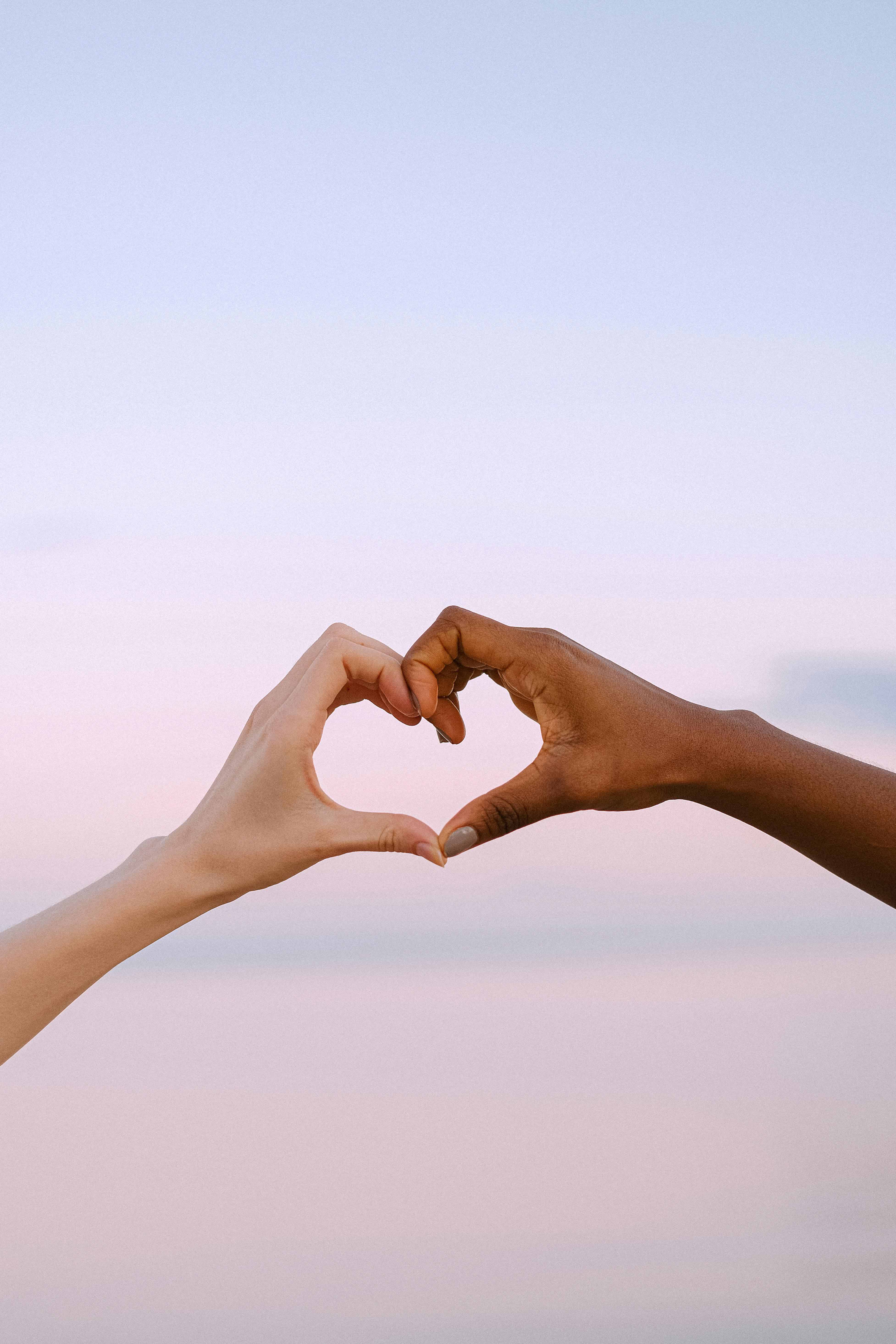 Two Arms coming together to form a heart
