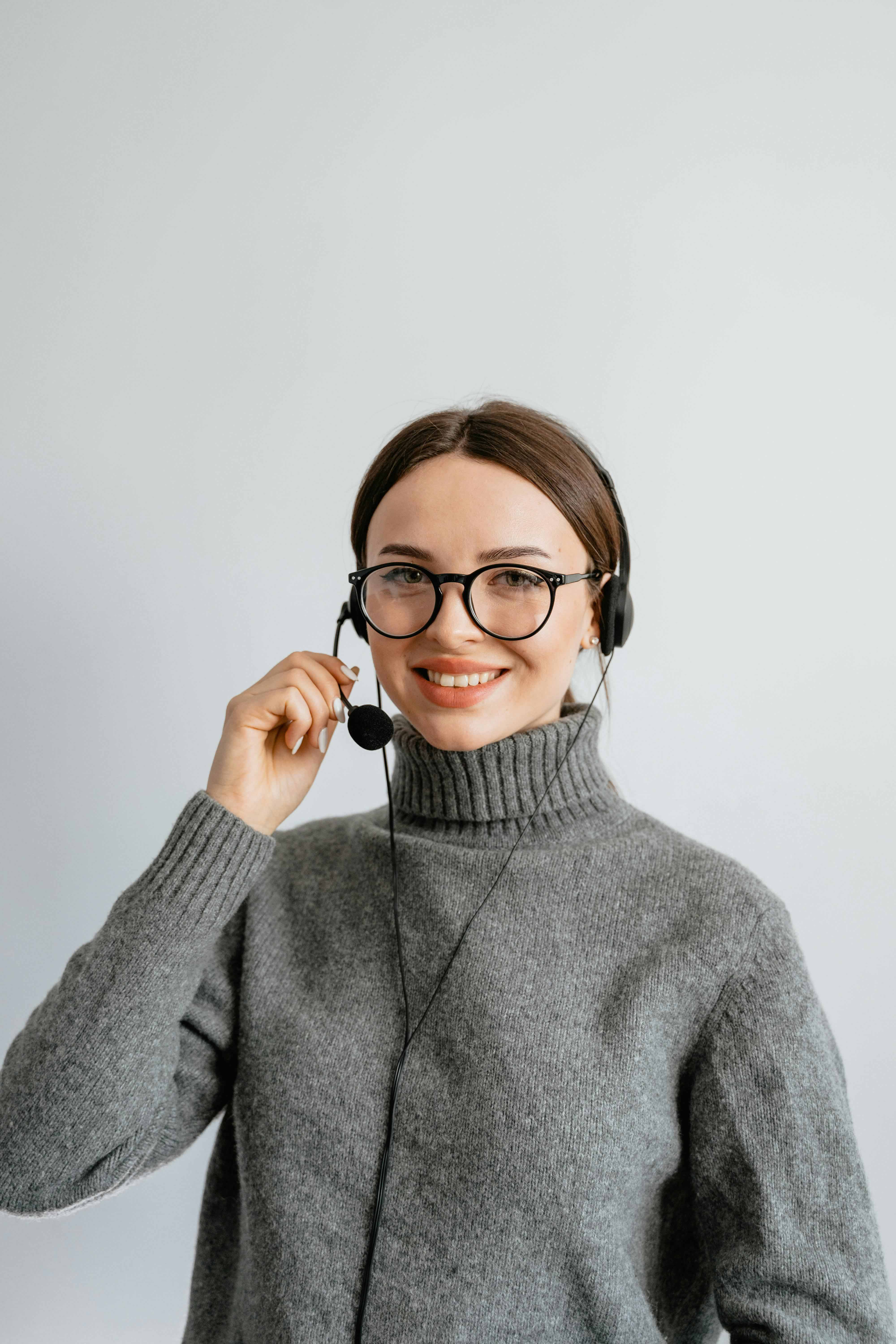 A woman wearing a headset and microphone
