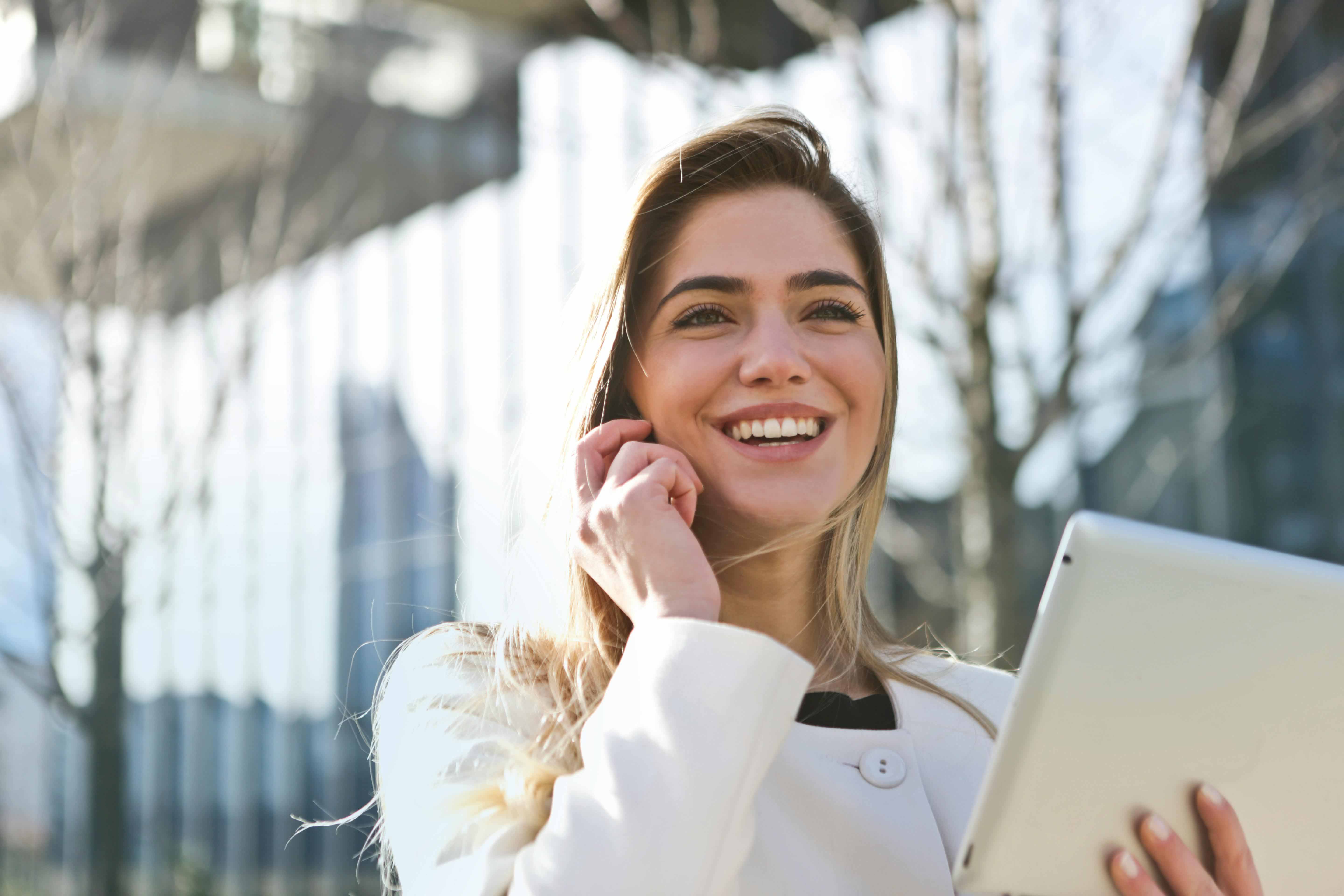 confident women walking on while on the phone