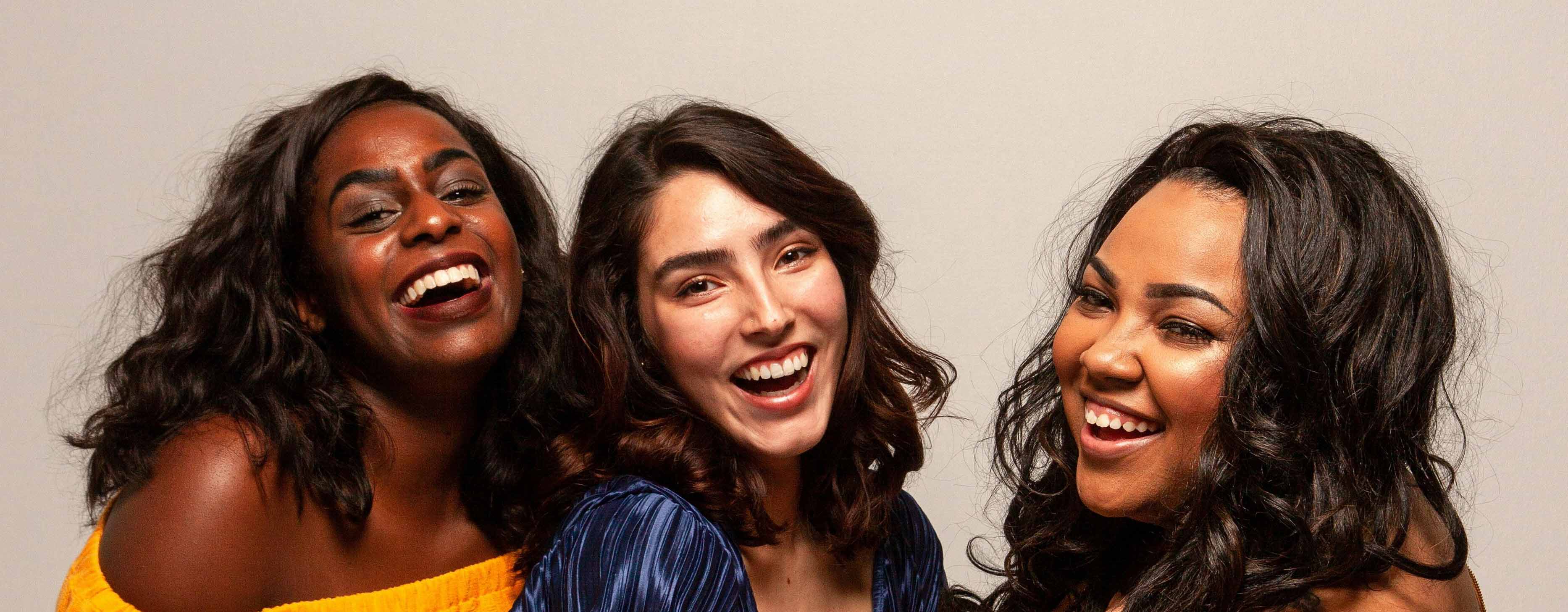 A Group of women smiling at the viewer