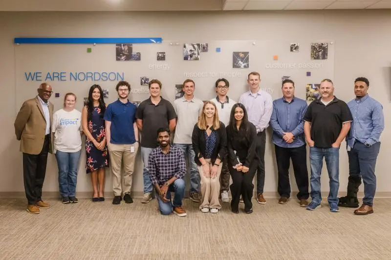 Photo of me with along with the rest of the interns at nordson with Naga the CEO of Nordson on the left